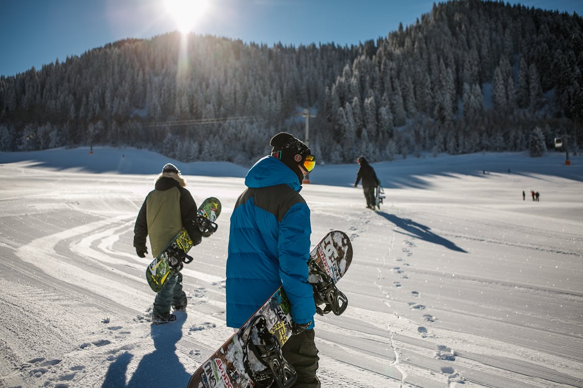 Skiers on the slopes at Niseko ski resort in Hokkaido Japan with Mount Yotei in background
