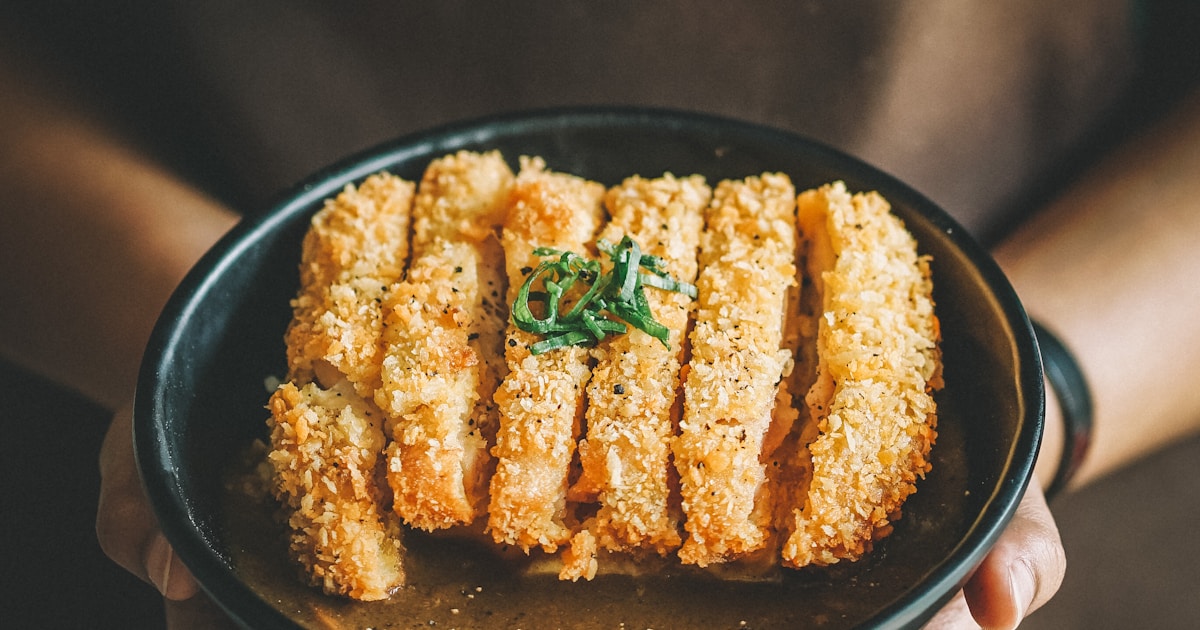 Osaka street food market with takoyaki and street snacks Japan