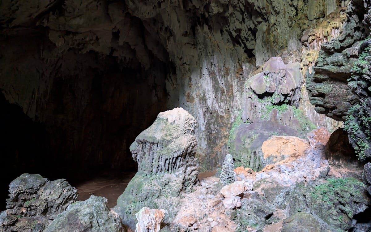 Vast ancient limestone cave with stalactites and rock formations