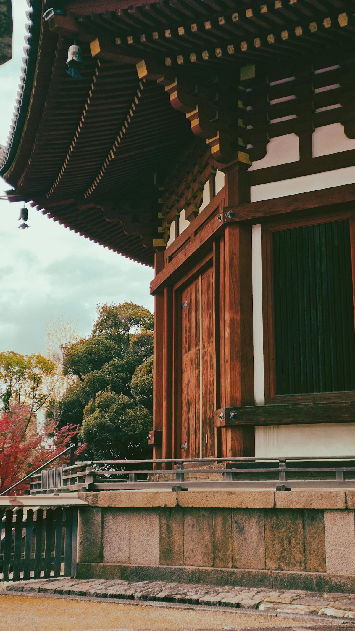 Traditional wooden Japanese temple surrounded by lush greenery in Iwate Prefecture