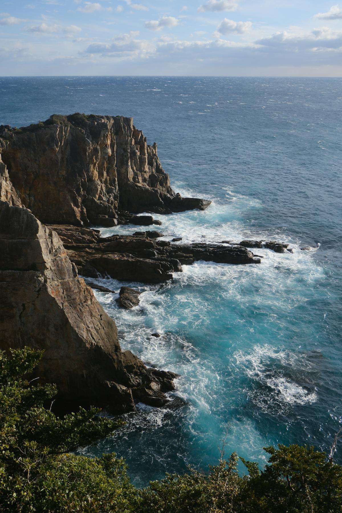 Dramatic coastal cliffs and crashing Pacific waves along Kochi Prefecture southern coastline in Shikoku Japan