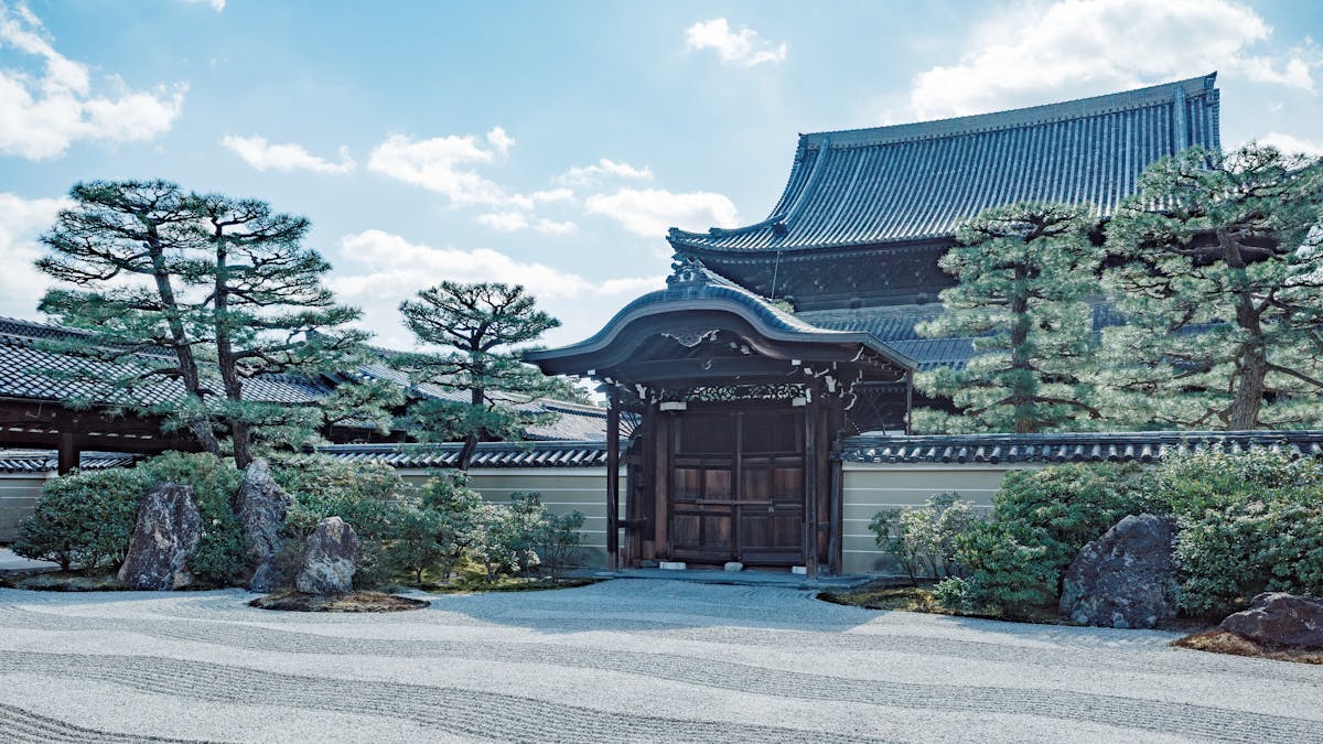 Traditional Japanese Zen temple and garden with wooden gate