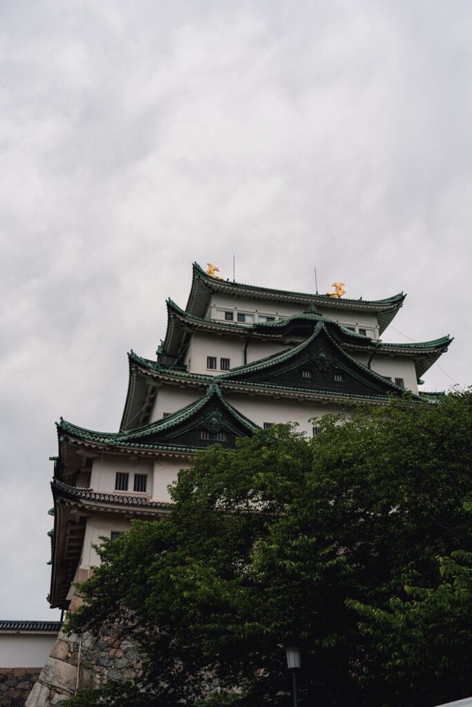 Nagoya Castle main keep with traditional architecture and golden roof ornaments in Aichi, Japan
