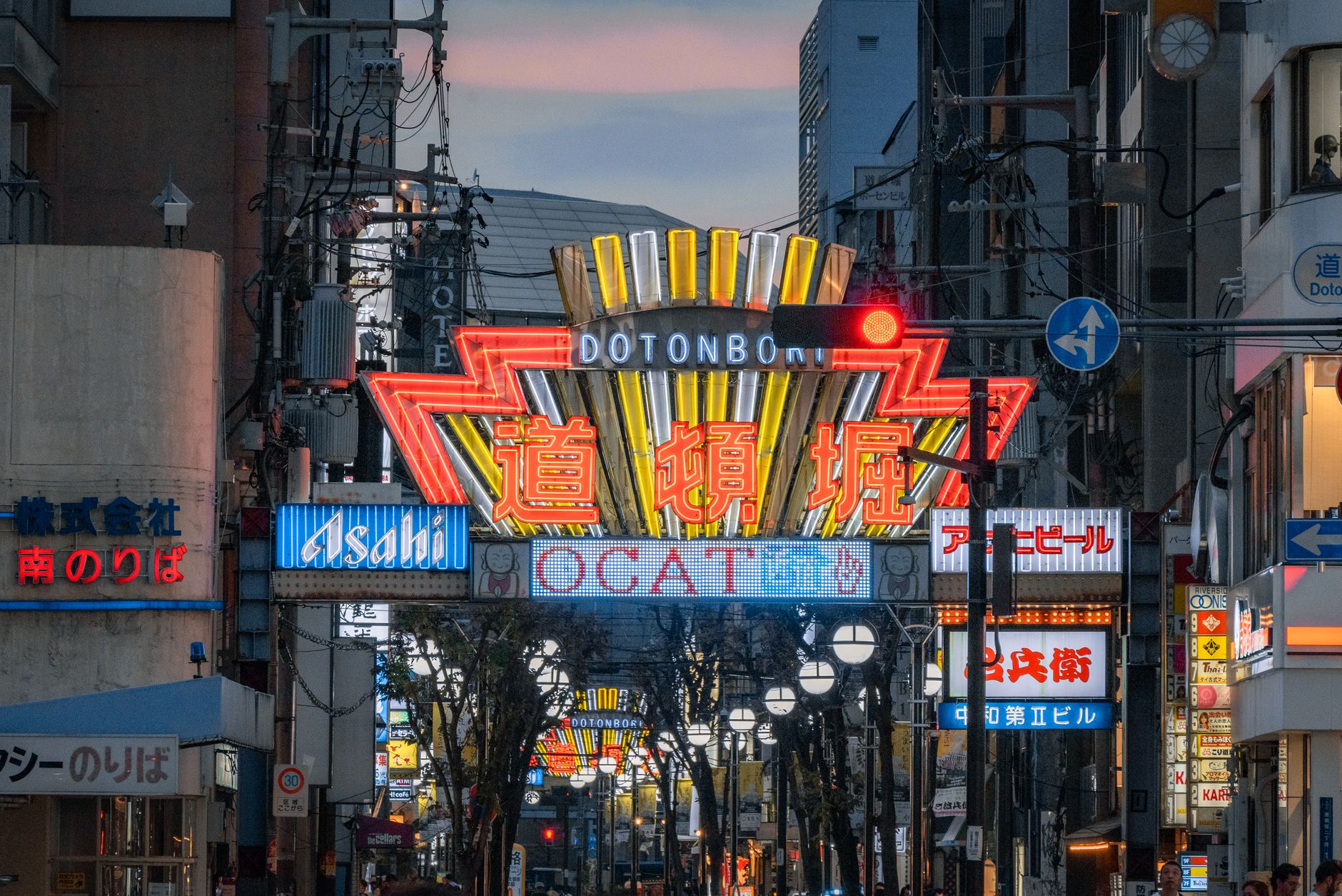 Neon signs reflected on the Dotonbori canal in Osaka at night