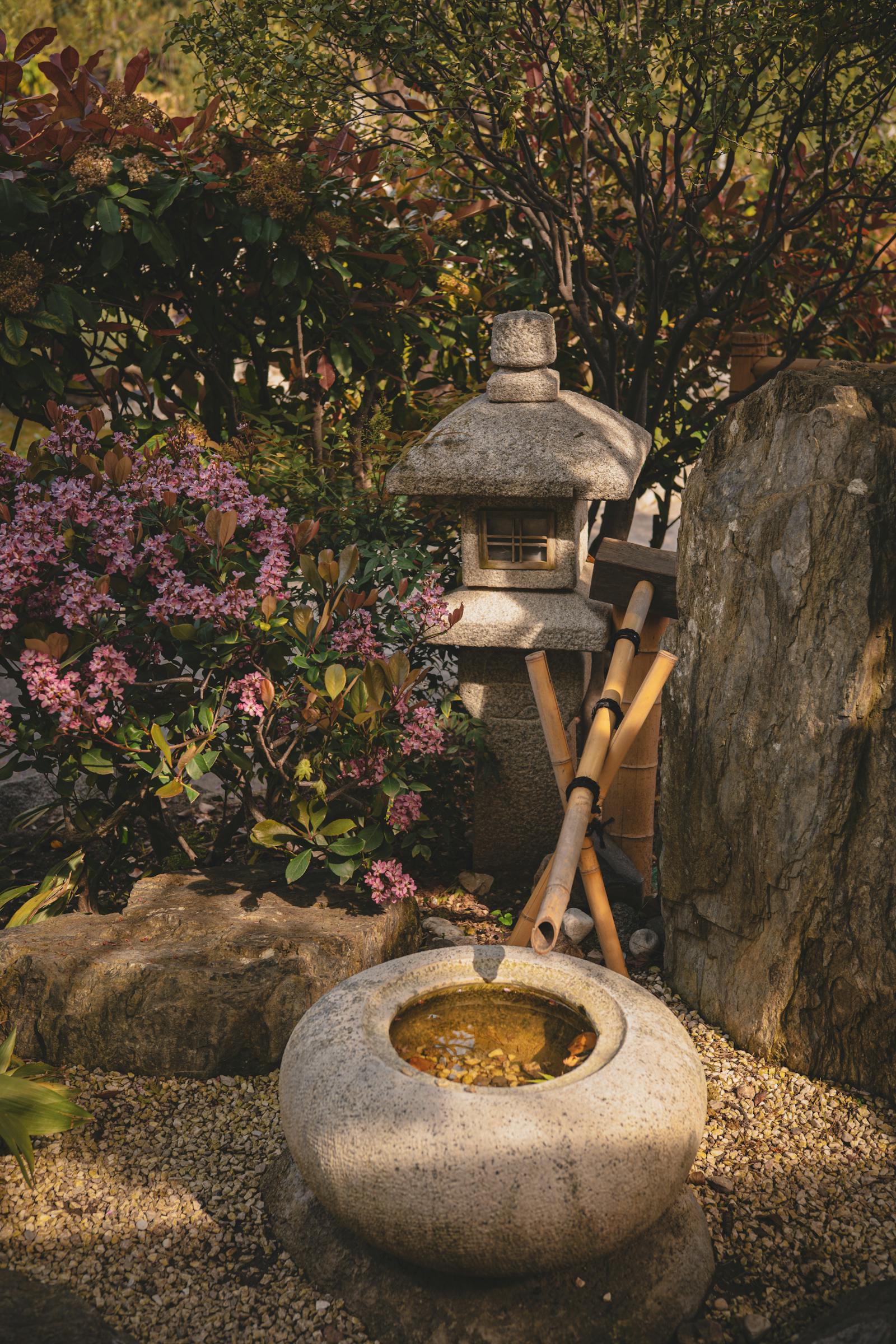 Stone lantern and bamboo fountain in a Japanese garden, Takamatsu Kagawa