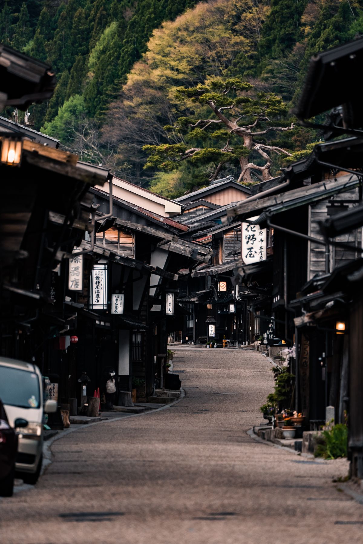 Historic wooden machiya houses lining a traditional street in an old Japanese merchant town