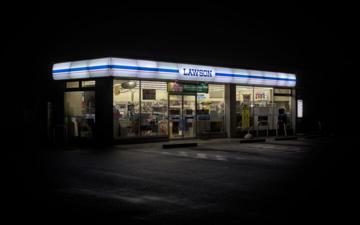 A brightly lit Japanese convenience store at night