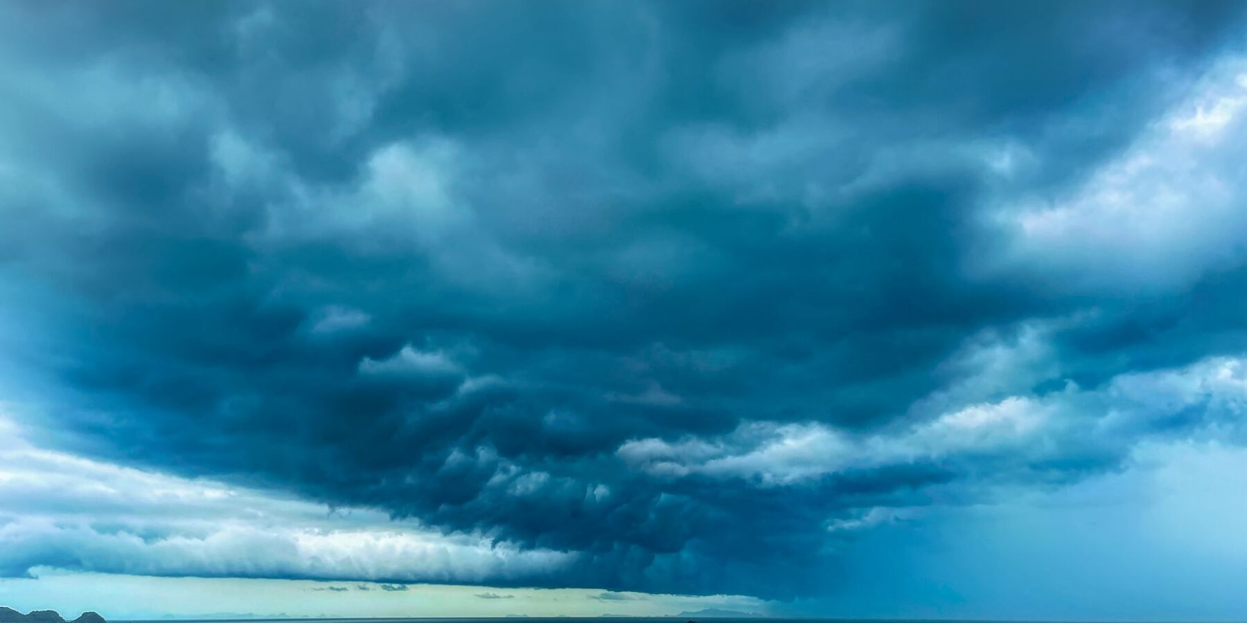 Dark storm clouds gathering over the ocean