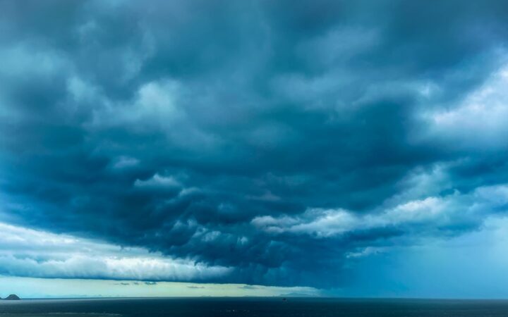 Dark storm clouds gathering over the ocean