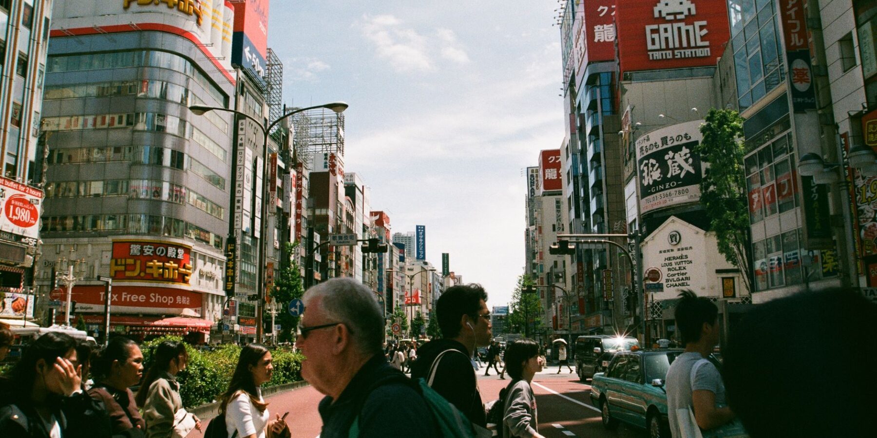 A traveler exploring a busy Tokyo street