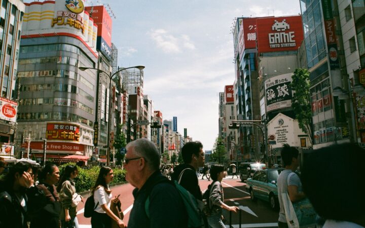 A traveler exploring a busy Tokyo street