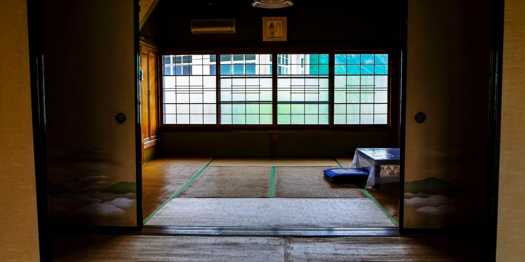 A traditional Japanese ryokan room with tatami floors