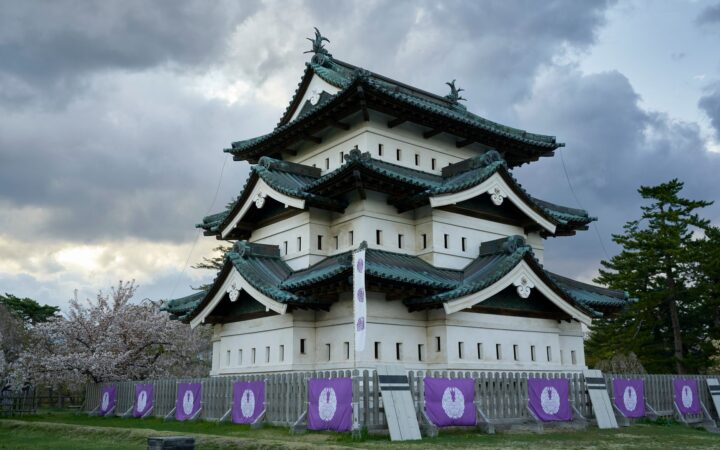 Hirosaki Castle keep with cherry blossoms in Hirosaki, Aomori