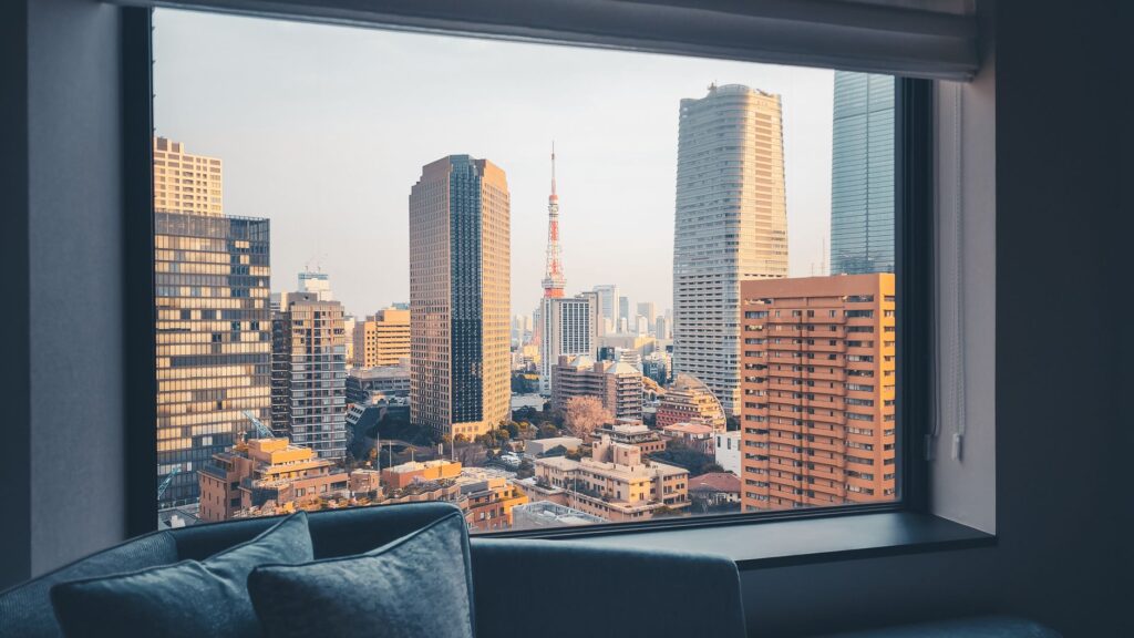 Tokyo skyline with Tokyo Tower framed by a hotel room window, Japan