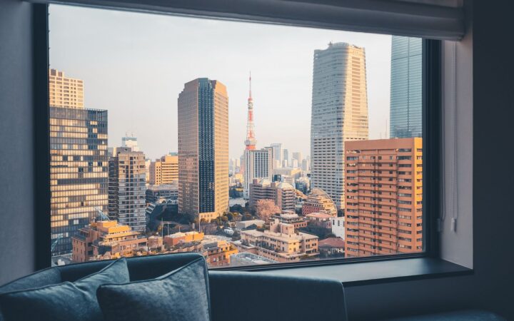 Tokyo skyline with Tokyo Tower framed by a hotel room window, Japan