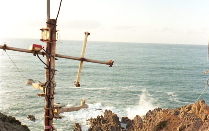 Rugged rocky Sea of Japan coastline with a lighthouse in Sakai, Fukui, Japan