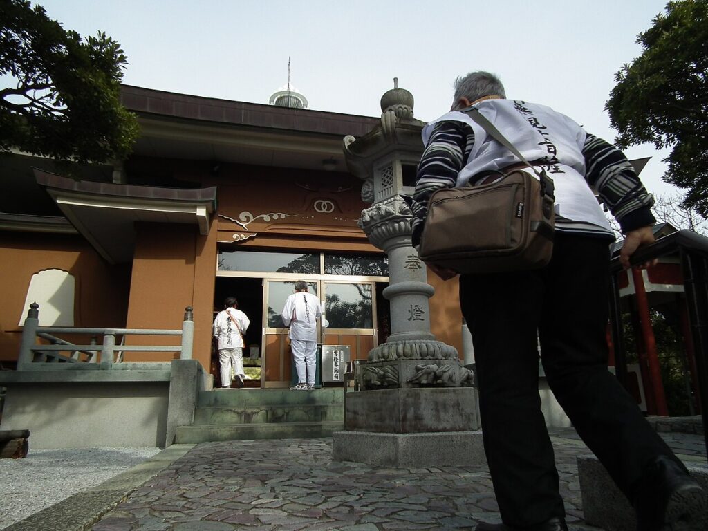 A pilgrim at the Main Hall of Shinshoji, Temple 25 of the Shikoku pilgrimage