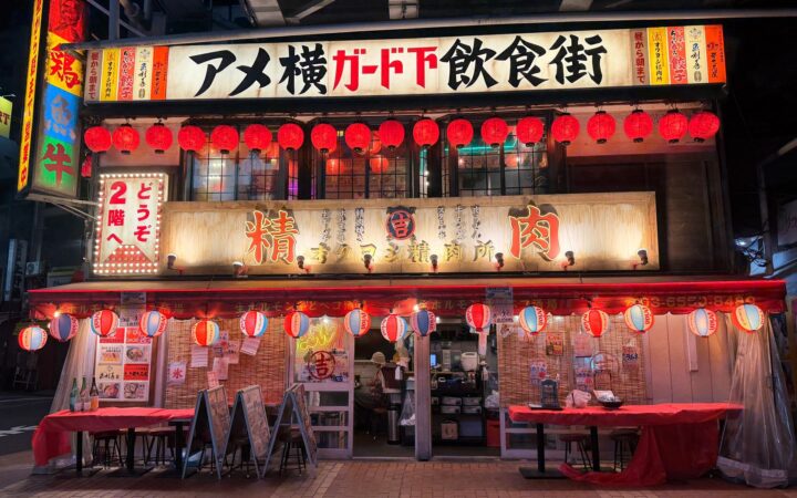 Red-lantern izakaya stalls under the railway tracks at Ameyoko in Ueno, Tokyo