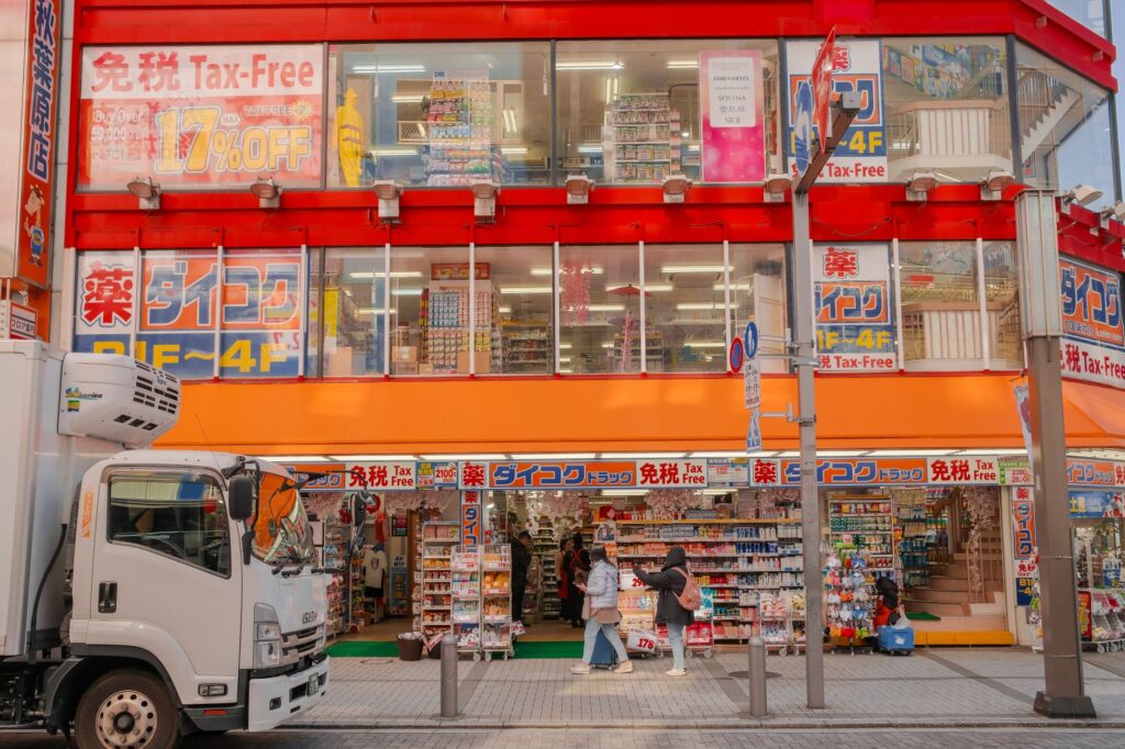 Japanese drugstore with a red Tax-Free sign above the entrance