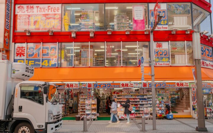 Japanese drugstore with a red Tax-Free sign above the entrance