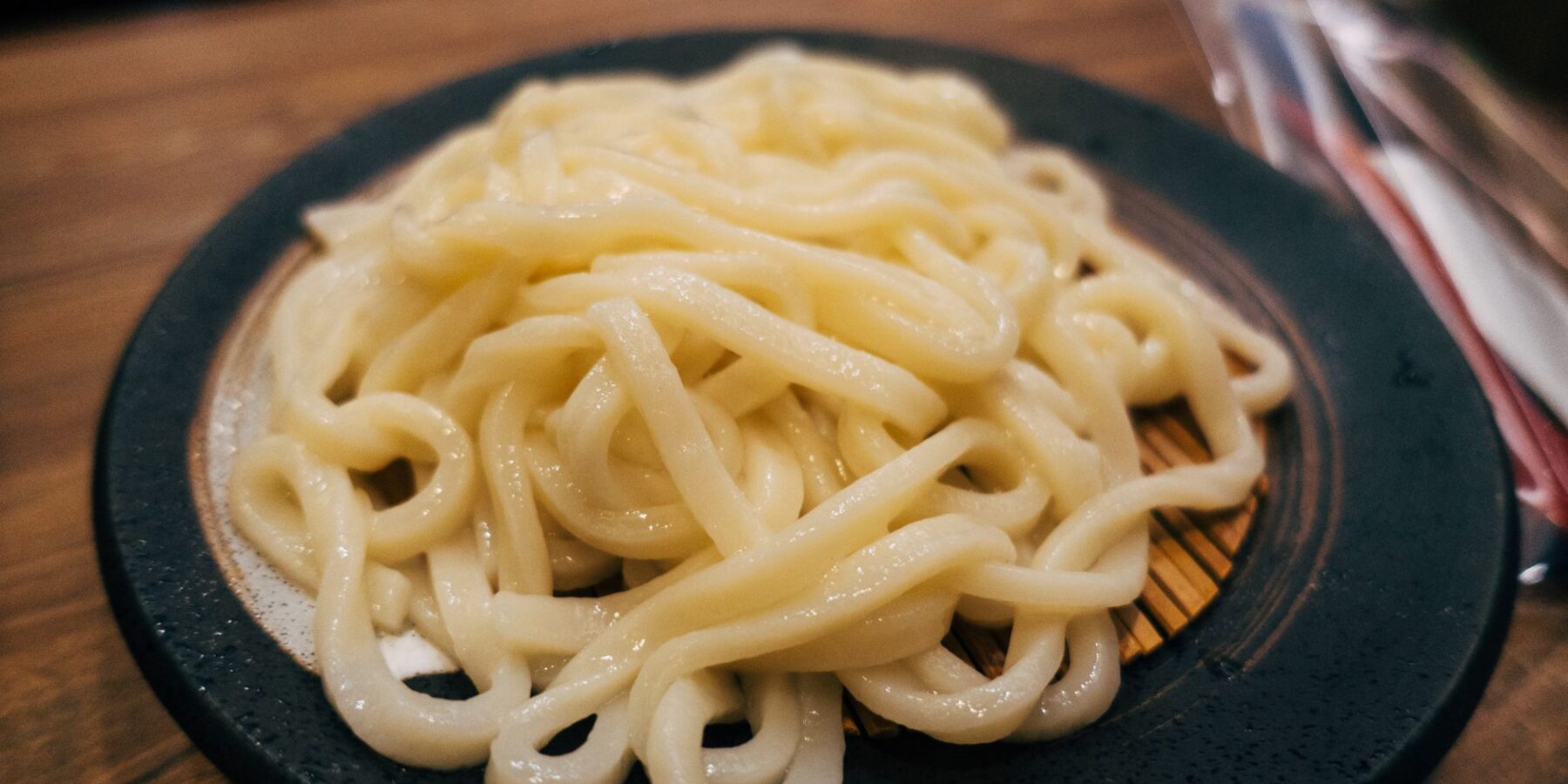 Plate of thick, chewy Sanuki-style udon noodles