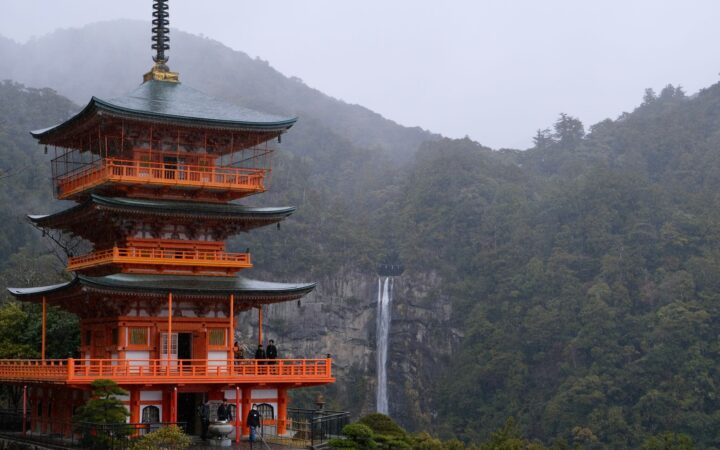 Seiganto-ji three-story pagoda with Nachi Falls behind on the Kumano Kodo, Wakayama