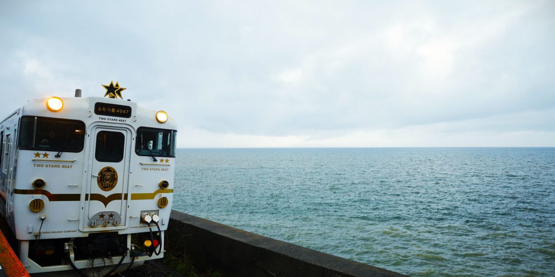 Train running along the Omura Bay shoreline in Higashisonogi, Nagasaki Prefecture