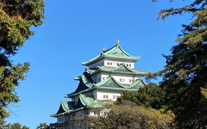 Nagoya Castle with green copper roofs under a blue sky in Aichi, Japan