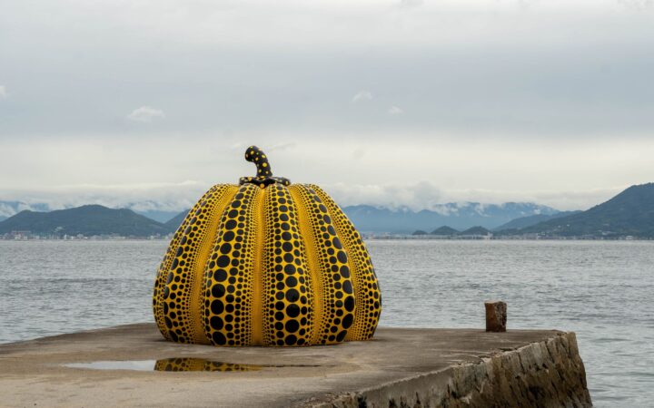 Yayoi Kusama yellow pumpkin sculpture on the pier at Naoshima, Kagawa, Japan