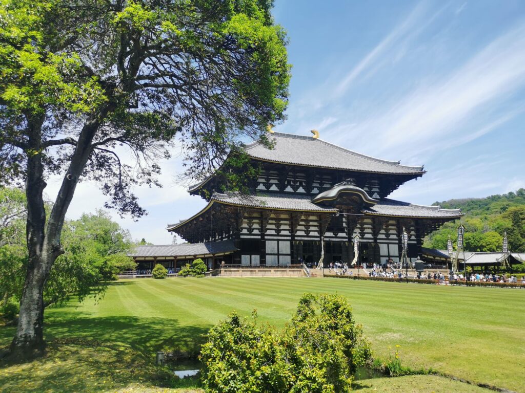Todaiji Temple Great Buddha Hall behind green lawns in Nara, Japan