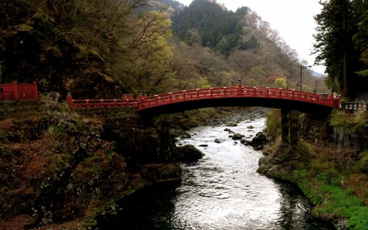 Red Shinkyo Bridge over the Daiya River surrounded by forest in Nikko, Tochigi, Japan