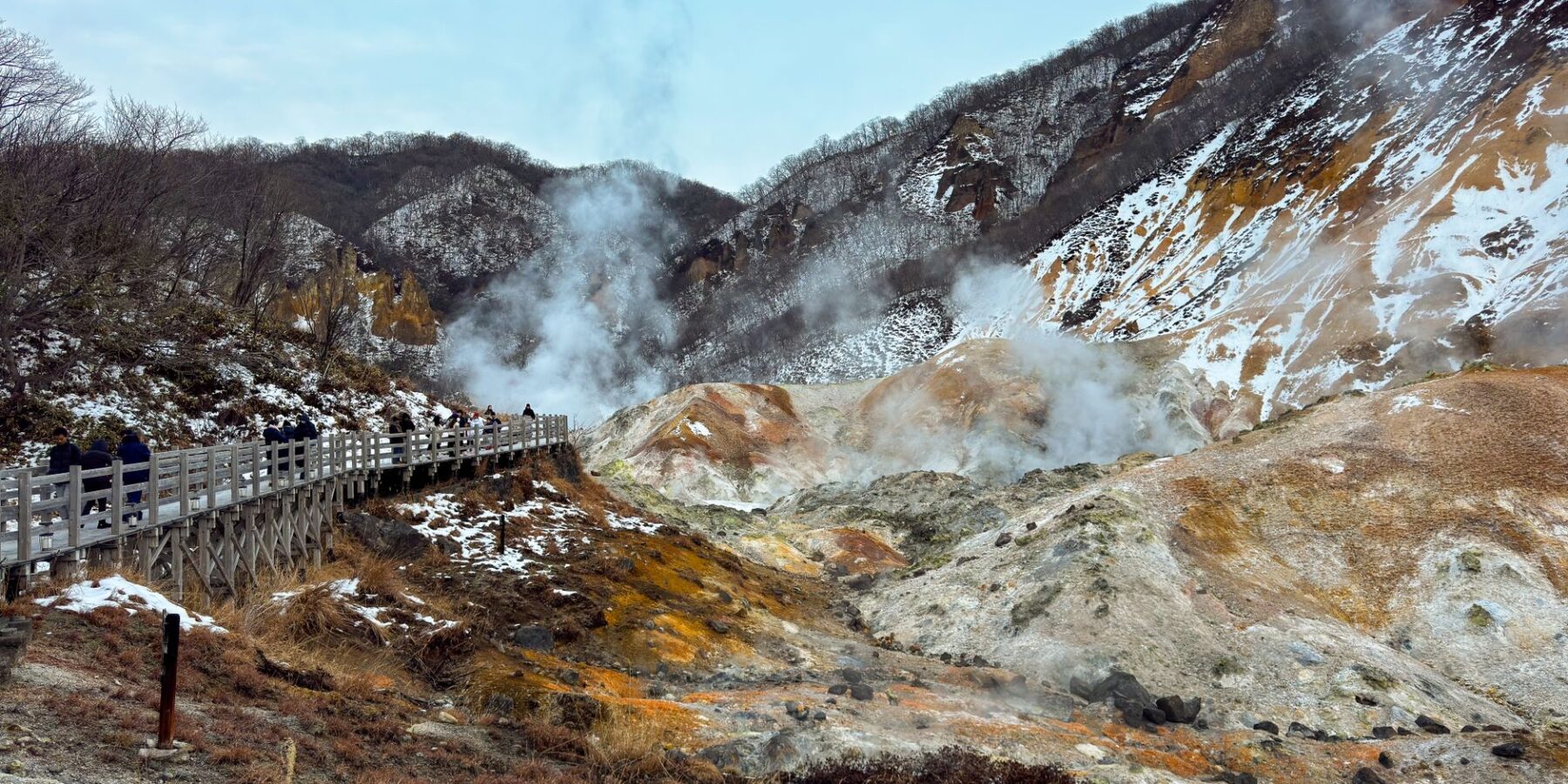 Steaming volcanic slopes and boardwalk at Noboribetsu Jigokudani (Hell Valley), Hokkaido