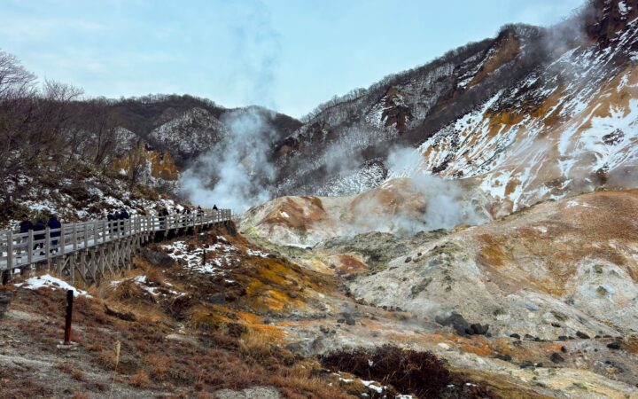 Steaming volcanic slopes and boardwalk at Noboribetsu Jigokudani (Hell Valley), Hokkaido