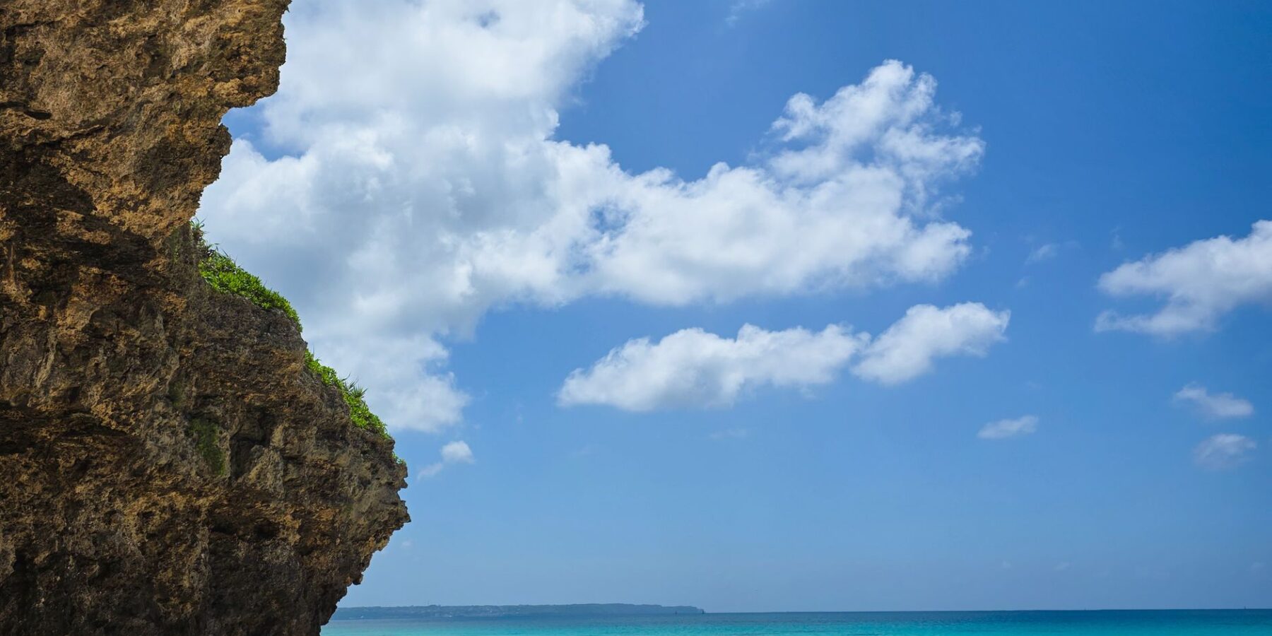 White sand beach, limestone cliff and turquoise sea on Miyakojima, Okinawa, Japan