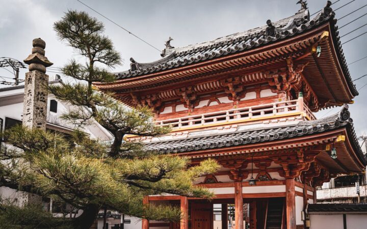Vermilion temple gate among pine trees on Shodoshima, Kagawa Prefecture, Shikoku