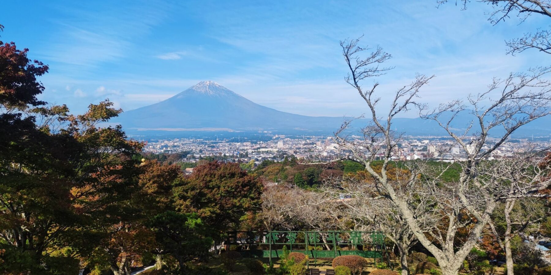 Mount Fuji framed by autumn foliage seen from Fujinomiya, Shizuoka, Japan