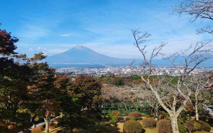 Mount Fuji framed by autumn foliage seen from Fujinomiya, Shizuoka, Japan