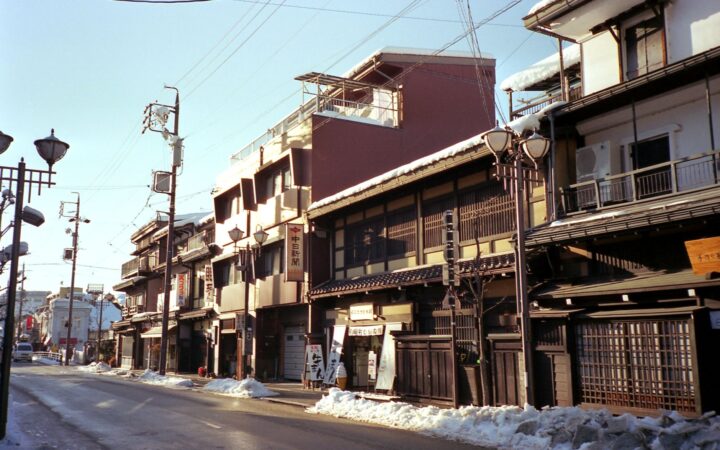 Traditional wooden merchant houses on a historic street in Takayama, Gifu, Japan