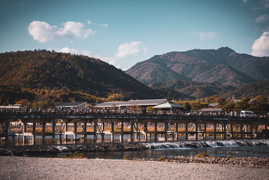 Togetsukyo Bridge crossing the river below the wooded hills of Arashiyama in Kyoto