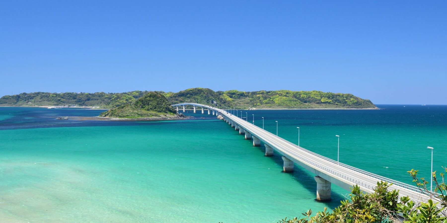 Tsunoshima Bridge crossing turquoise water in Yamaguchi, Japan